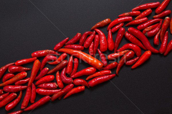 Row of non-stem red bird eye chili peppers  Stock photo © Elisanth