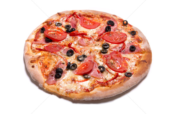 Delicious Italian pizza with ham, tomatoes, and olives  Stock photo © Elisanth