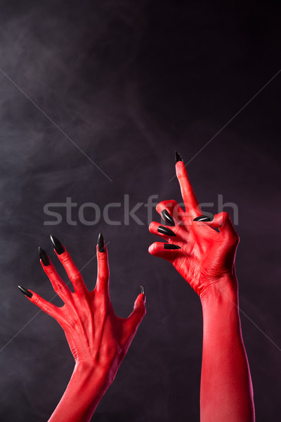 Scary czerwony diabeł ręce czarny paznokcie Zdjęcia stock © Elisanth