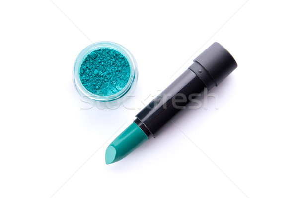 Top view of a lipstick and eye shadow in jar in bright teal gree Stock photo © Elisanth