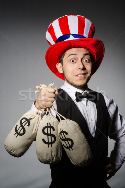 Funny man with american hat and sacks of money Stock photo © Elnur