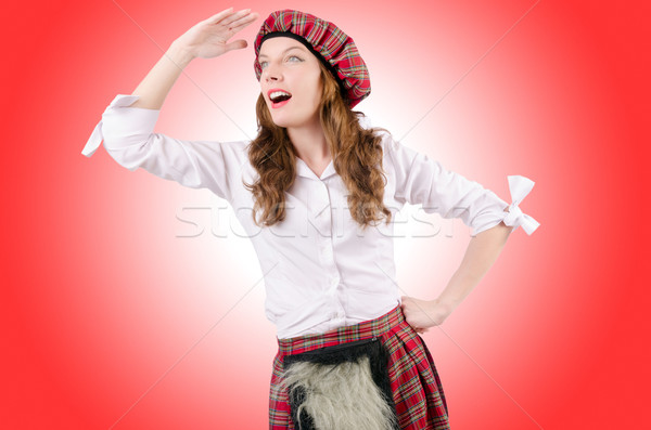 Young woman in traditional scottish clothing Stock photo © Elnur