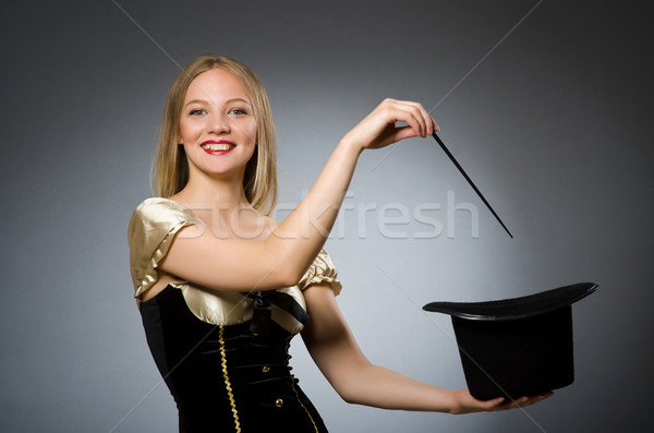 Stock photo: Woman magician with magic wand and hat
