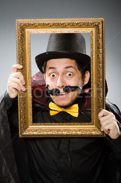 Funny man with picture frame Stock photo © Elnur