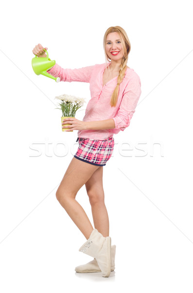 Pretty girl watering the flowers isolated on white Stock photo © Elnur