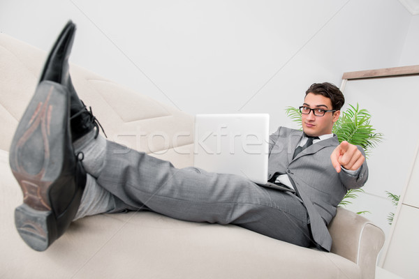 Young businessman lying on the sofa Stock photo © Elnur