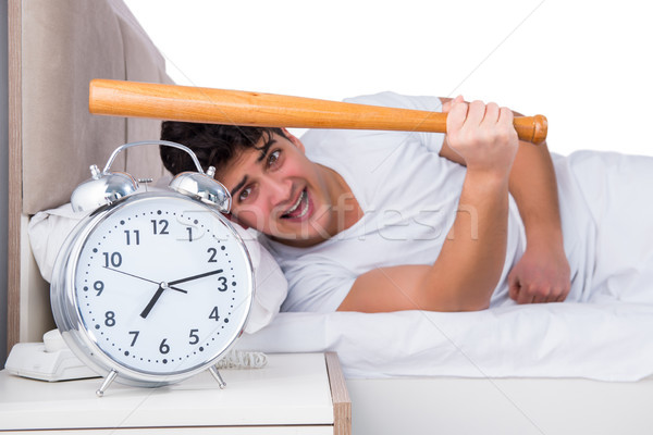 Férfi ágy szenvedés álmatlanság óra egészség Stock fotó © Elnur