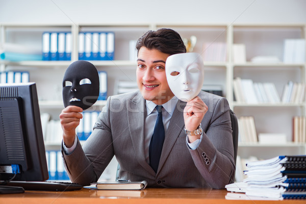 The businessman with mask in office hypocrisy concept Stock photo © Elnur