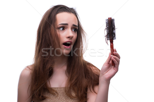 Woman in beauty concept combing hair loosig loss Stock photo © Elnur
