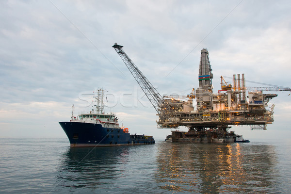 Oil rig being tugged in the sea Stock photo © Elnur
