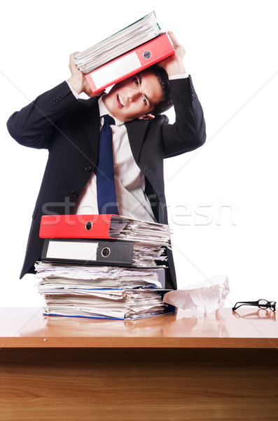 Young busy businessman at his desk Stock photo © Elnur