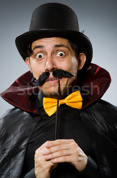 Funny magician man with wand and hat Stock photo © Elnur