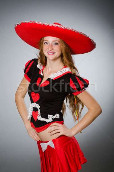 Szép nő visel piros szombréró kalap Stock fotó © Elnur