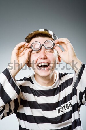 Prisoner in striped uniform on white Stock photo © Elnur