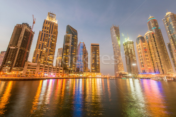 Dubai marina felhőkarcolók éjszaka égbolt víz Stock fotó © Elnur