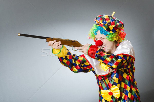 Clown with rifle isolated on white Stock photo © Elnur