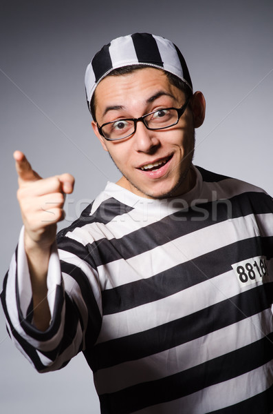 Young prisoner against gray Stock photo © Elnur