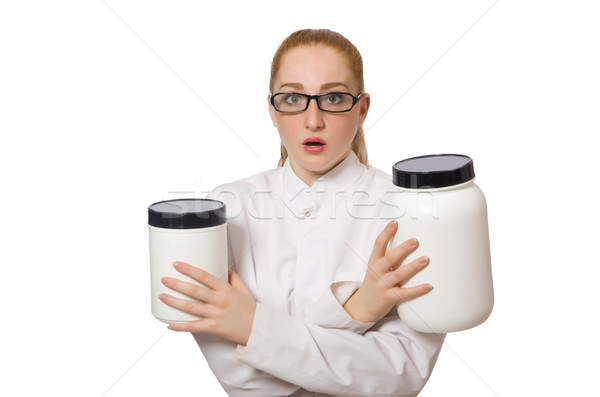 Young female doctor holding jar of protein isolated on white Stock photo © Elnur