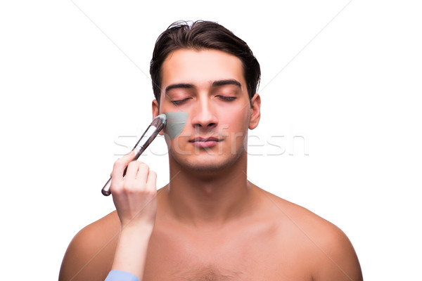 Man with face mask being applied on white Stock photo © Elnur