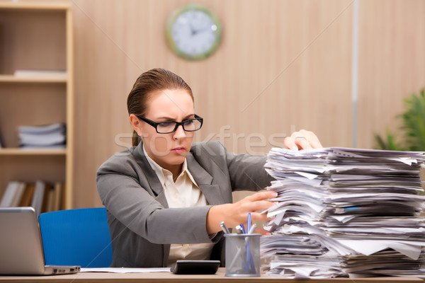 Businesswoman under stress from too much work in the office Stock photo © Elnur