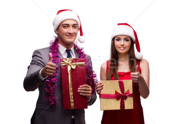 The pair celebrating christmas in the office isolated on white Stock photo © Elnur