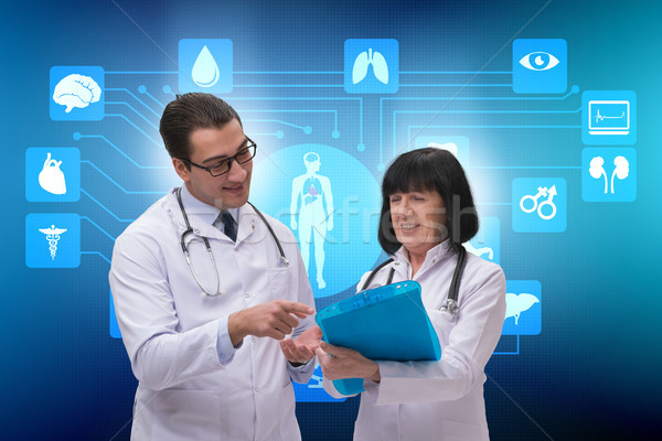 Two doctors discussing issues in telemedicine concept Stock photo © Elnur