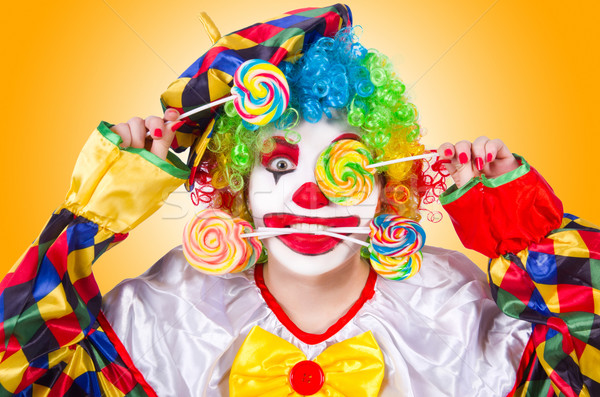 Clown with lollipops isolated on white Stock photo © Elnur
