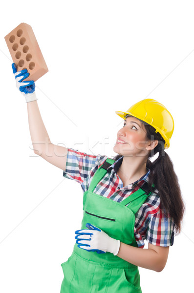Female workman in green overalls holding brick isolated on white Stock photo © Elnur