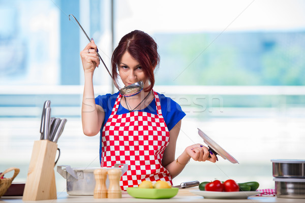 Woman preparing soup in the kitchen Stock photo © Elnur