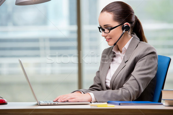 Call center operator working at her desk Stock photo © Elnur