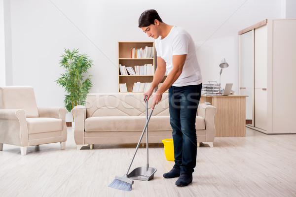 Homme nettoyage maison balai industrie travail Photo stock © Elnur