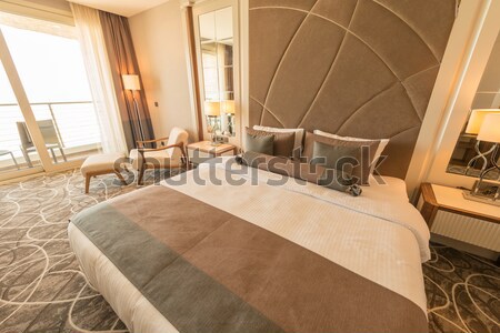 Modern hotel room with big bed Stock photo © Elnur