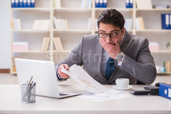 The businessman spilling coffee on important documents Stock photo © Elnur