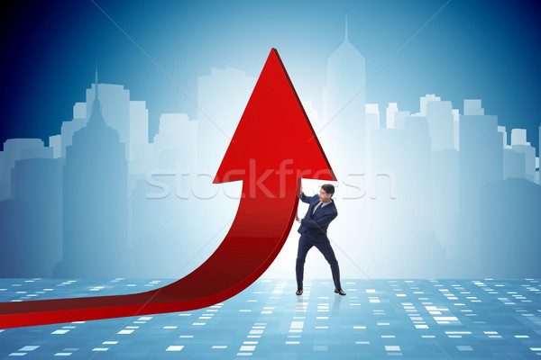 Businessman supporting growtn in economy on chart graph Stock photo © Elnur