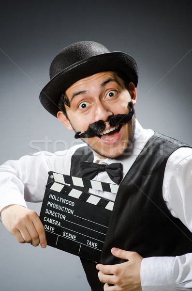 Funny man with movie clapper board  Stock photo © Elnur