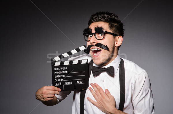 Junger Mann falsch Schnurrbart isoliert grau Mann Stock foto © Elnur