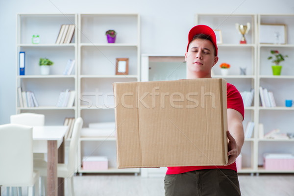 Post man delivering a parcel package Stock photo © Elnur