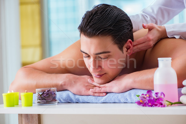 Handsome man in spa massage concept Stock photo © Elnur