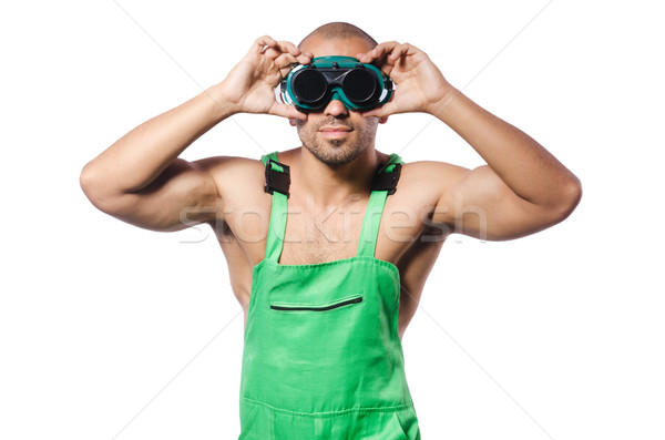 Man in green coveralls with goggles Stock photo © Elnur