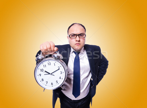 Businessman with clock against the gradient Stock photo © Elnur