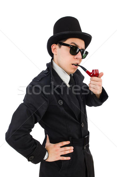 Young detective in black coat holding magnifying glass isolated  Stock photo © Elnur