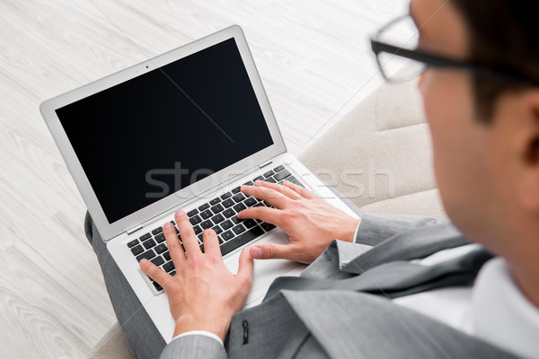 Businessman working with laptop in business concept Stock photo © Elnur