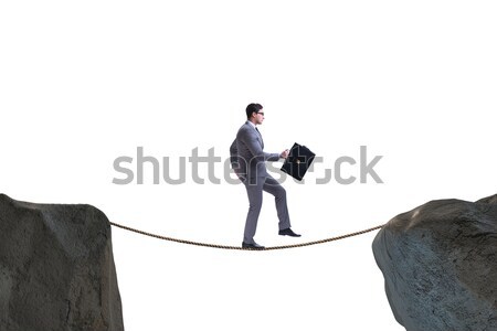 The businessman walking on tight rop in business concept Stock photo © Elnur