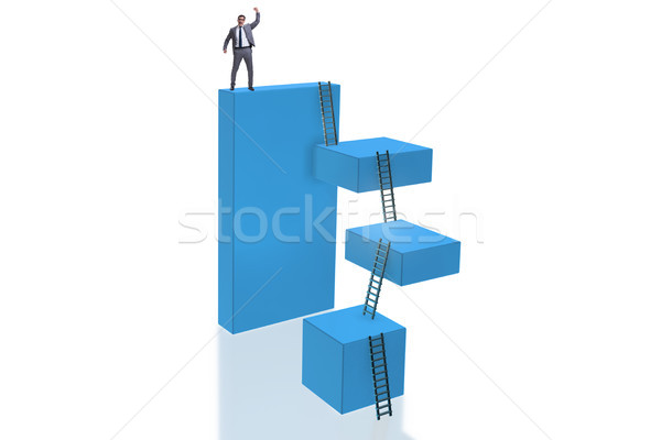 Businessman on top of block isolated on white Stock photo © Elnur