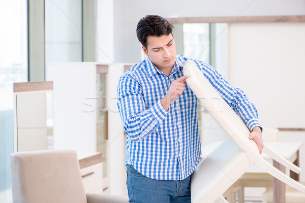 The young man shopping in furniture store Stock photo © Elnur