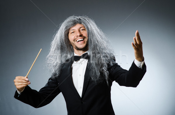 Funny conductor with long grey hair Stock photo © Elnur