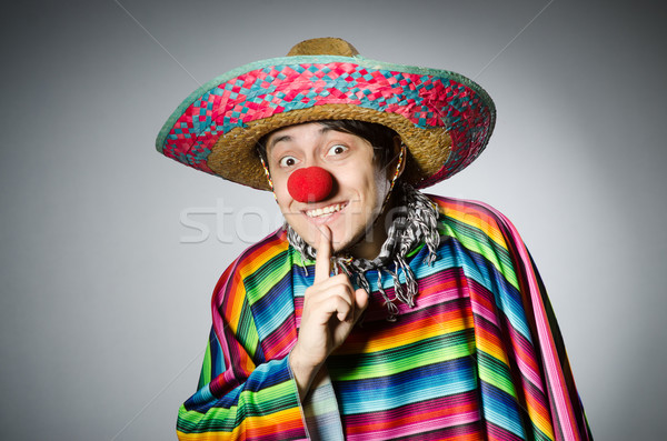 Man in vivid mexican poncho against gray Stock photo © Elnur