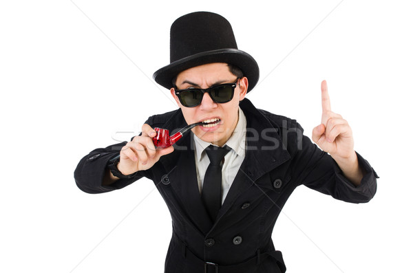 Young detective in black coat holding magnifying glass isolated  Stock photo © Elnur