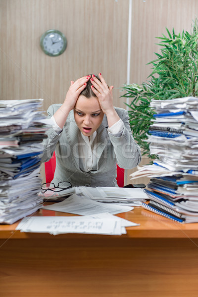 Woman under stress from excessive paper work Stock photo © Elnur