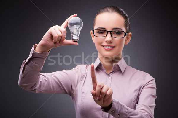 Stock photo: Businesswoman with lightbulb in business concept